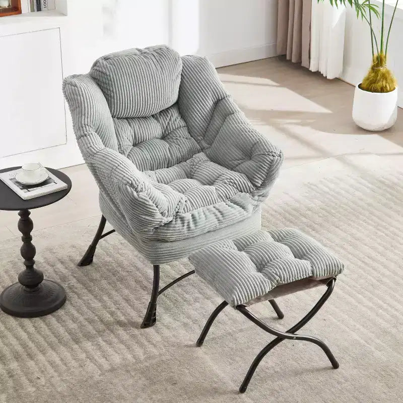 Poltrona accent lounge moderna con pouf, braccioli e tasca laterale