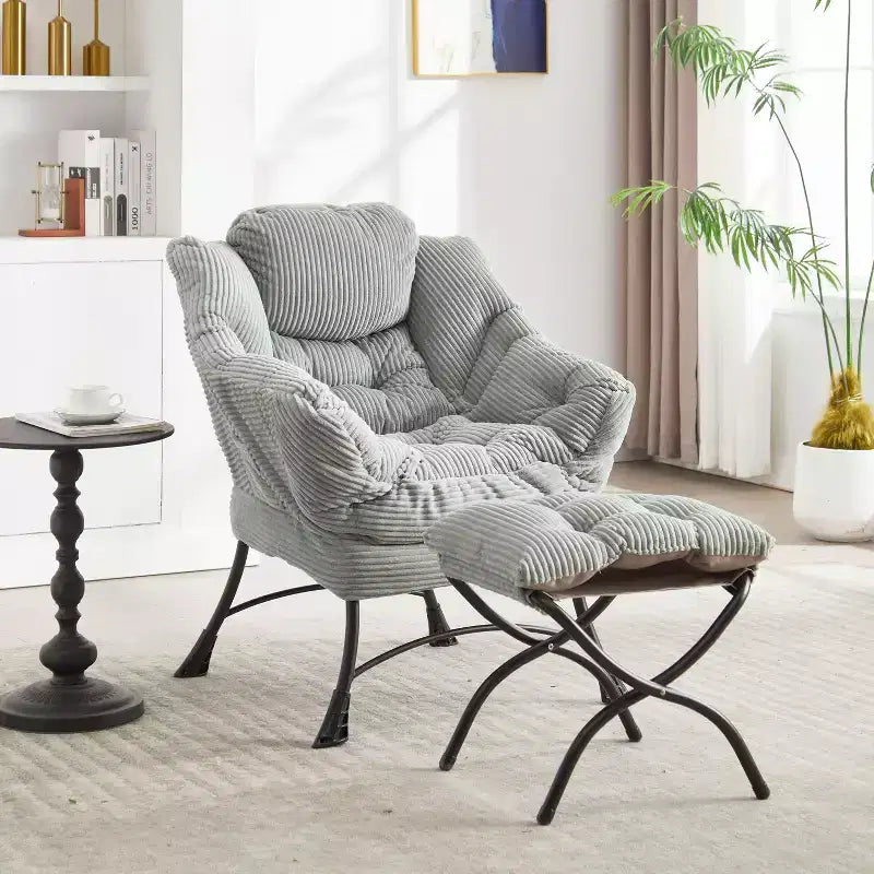 Poltrona accent lounge moderna con pouf, braccioli e tasca laterale